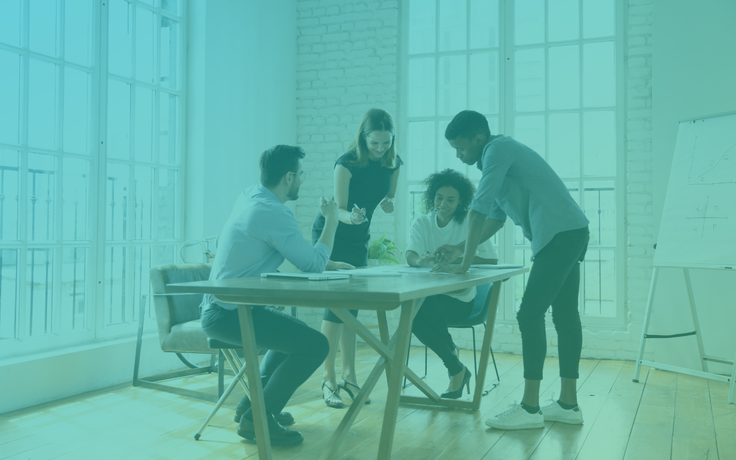 Four digital marketing professionals working at a table