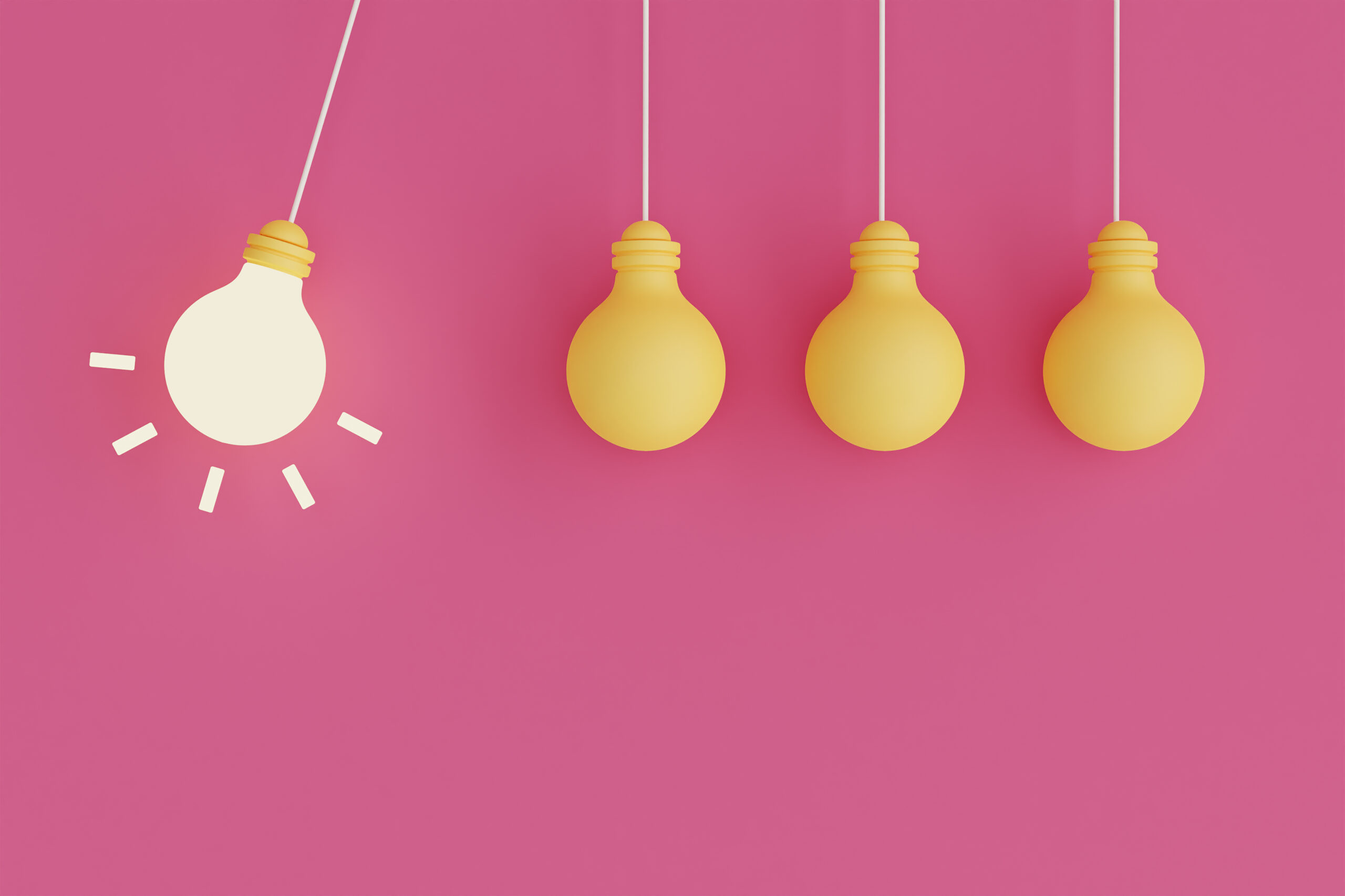 Four lightbulbs pictured in front of a dark pink background. One of them is lit.