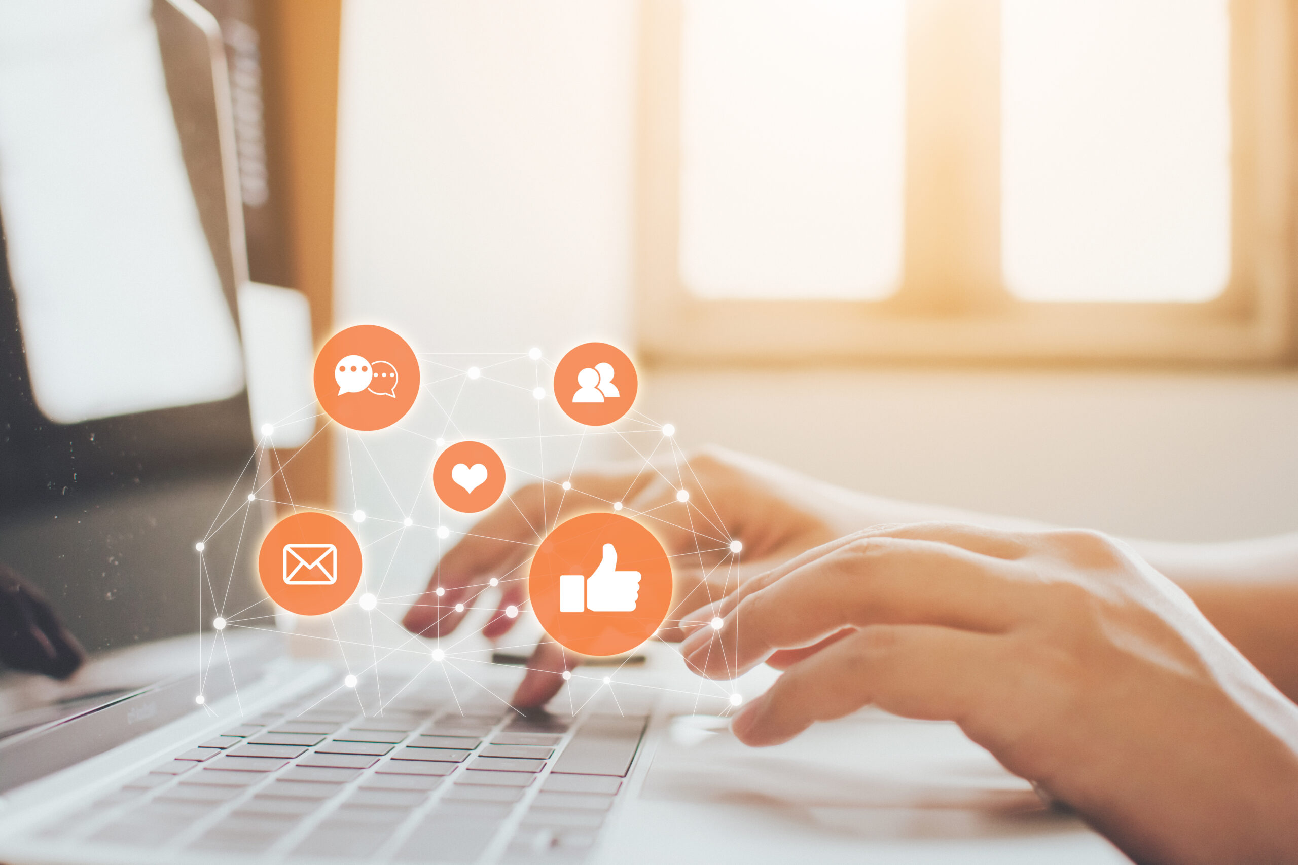 Hand of businessman using laptop with icon social media and social network.